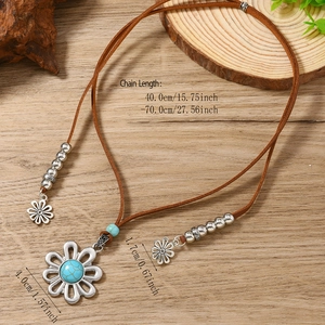 Bohemian leather necklace with vintage silver flower pendant and turquoise stone inlay