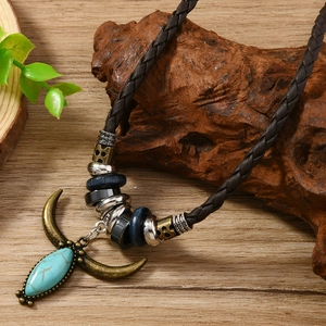 Vintage western turquoise teardrop pendant on brown woven leather cord necklace