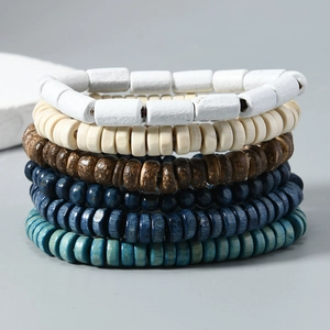 Macro view showing various textures of multi-layer bohemian handmade wood bead bracelets