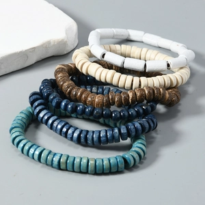 Five-piece stacked wooden bead bracelet set with mixed colors and natural textures