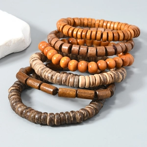 Detail view of 6-piece handmade wooden bead bracelets with natural brown textures