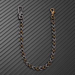 Detail of gothic skull wallet chain with silver and copper finish for bikers