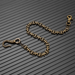 Detailed close-up of gothic cross wallet chain links with vintage bronze finish