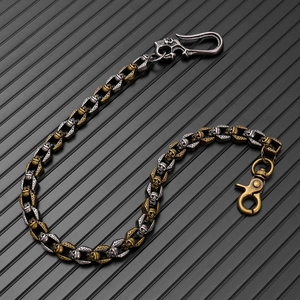 Detailed view of dual-tone skull link chain with gothic punk metal hooks and engraving