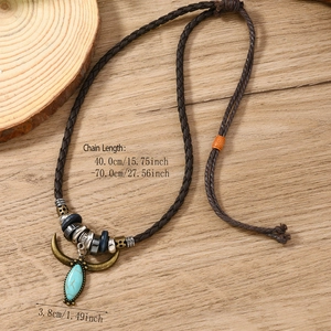 Vintage western turquoise pendant necklace on wood background with size annotations