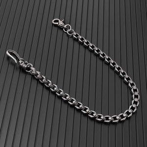 Macro shot of silver skull chain links with gothic punk metal hooks and vintage texture