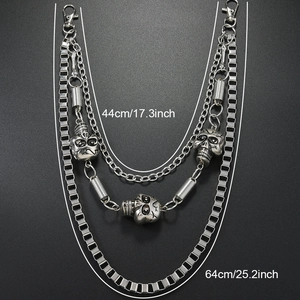Detail of triple-layer punk trousers chain with skulls and measurements 44cm to 64cm