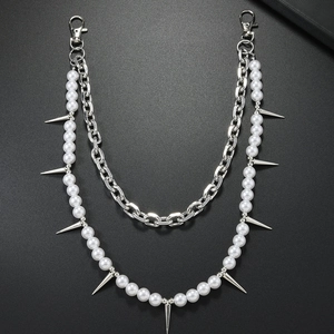 Detail of double-layer punk chain featuring white pearls and silver metal spikes with lobster clasps