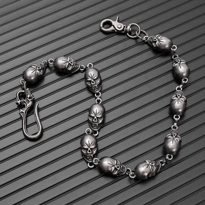 Close-up of gothic punk skull chain featuring vintage finish metal links and sturdy clasps