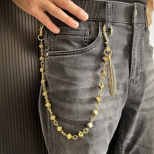 Retro dice pant chain with feather pendant on black jeans, hip hop metal belt accessory