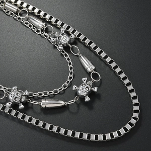 Silver punk hip hop multi-layer waist chain featuring skull pendants and bullet charms