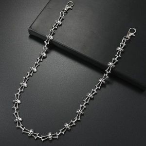 Punk hip-hop metal skull trouser chain with lobster clasps on a dark textured background