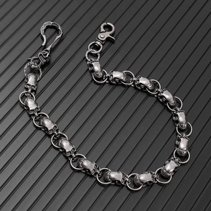 Macro shot of vintage skull chain links with aged silver finish and sturdy lobster clasp