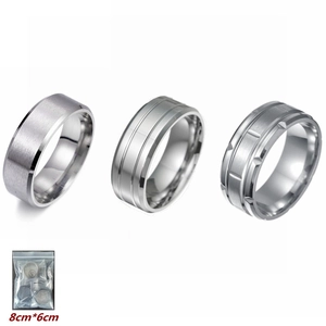 Three-piece silver matte titanium steel rings set featuring brushed finish and grooved patterns