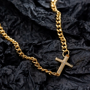 Minimalist gold Cuban chain necklace with a textured cross pendant for women