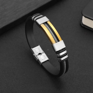 Men's titanium steel bracelet with black silicone strap and gold-tone metal accents