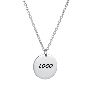 Macro view of polished silver round pendant and link chain for custom logo engraving