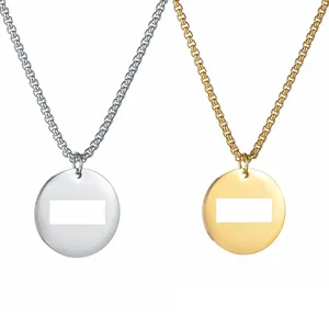 Detailed view of round titanium steel pendants in gold and silver with polished finishes