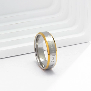Close-up of Forever Love engraving on two-tone stainless steel couple rings