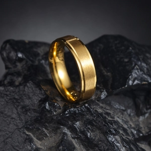 Minimalist 6mm gold titanium ring with a matte brushed center and polished step edges