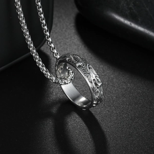 Silver titanium steel dragon relief ring pendant necklace with box chain on dark background