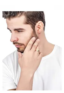 Close-up of a matte gold men's titanium steel ring on finger for daily casual style