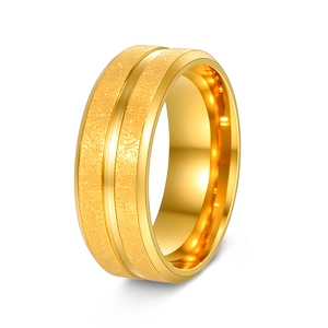 Close-up of matte titanium steel ring featuring a central polished groove and gold finish