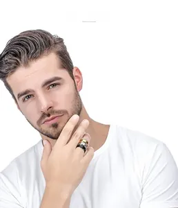 Three-piece men's titanium steel ring set in gold, silver, and black on a finger