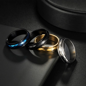Rhombus faceted stainless steel spinner rings in blue, black, gold and silver