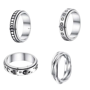 Stainless steel spinning ring set with moon phases and daisy patterns for stress relief