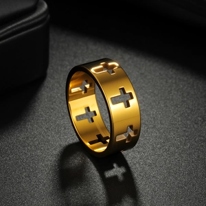 Gold hollow cross ring made of titanium steel displayed on a black jewelry background