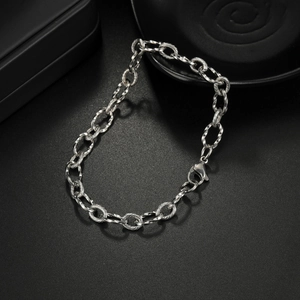 Polished stainless steel twist chain bracelet for couples featuring a lobster clasp