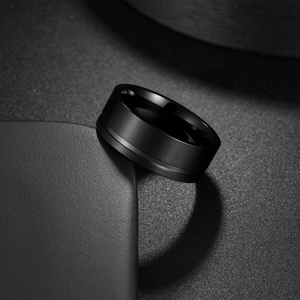 Minimalist black stainless steel men's ring with matte brushed finish and polished edges