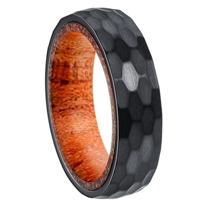 Detailed view of 6mm hammered black steel ring with natural wood inlay interior