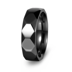 Detailed view of faceted honeycomb design on a black polished titanium steel ring