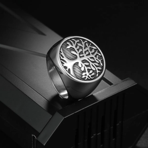 Vintage Tree of Life signet ring in cast titanium steel for men on dark background