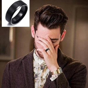 Matte black titanium steel men's ring with polished silver edges on model's hand