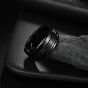 Men's matte black titanium steel ring with stepped edges and brushed metal finish