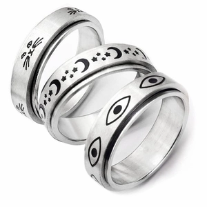 Three-piece stainless steel spinner ring set with star, moon and eye patterns