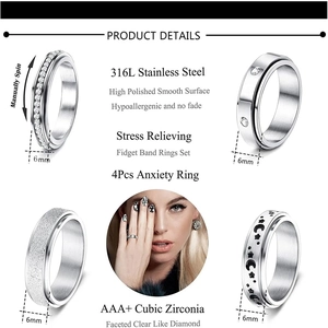Set of 4 stainless steel fidget rings with moon star patterns and cubic zirconia stones