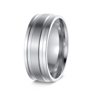 Macro shot of silver wide-band titanium steel ring with brushed finish and polished edges