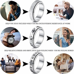 Three-piece stainless steel spinner ring set with star, moon and daisy engravings