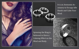 Detail of silver spinner ring with engraved moon and stars for stress relief