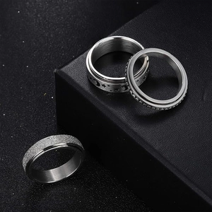 Three-piece silver spinner ring set with moon star relief and frosted finish