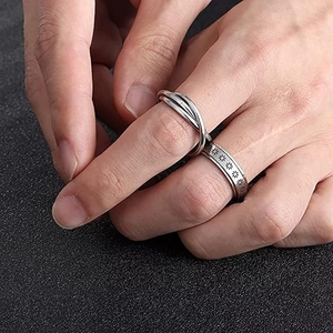 Silver stainless steel spinner ring set with star patterns and interlaced bands for men