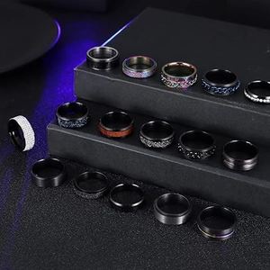 16-piece set of black titanium steel spinning rings with rainbow and rhinestone accents