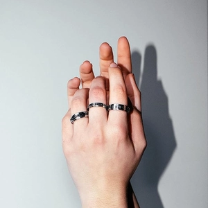 Three-piece stainless steel spinner ring set with celestial sun and star engravings