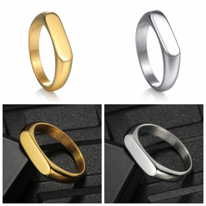 Polished gold and silver stainless steel minimalist band rings in a four-grid display