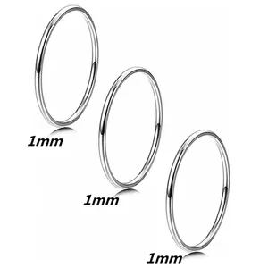 Three-piece set of 1mm minimalist silver stacking rings in polished stainless steel