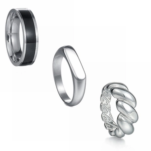 Polished stainless steel ring set with signet style and twisted band on white background